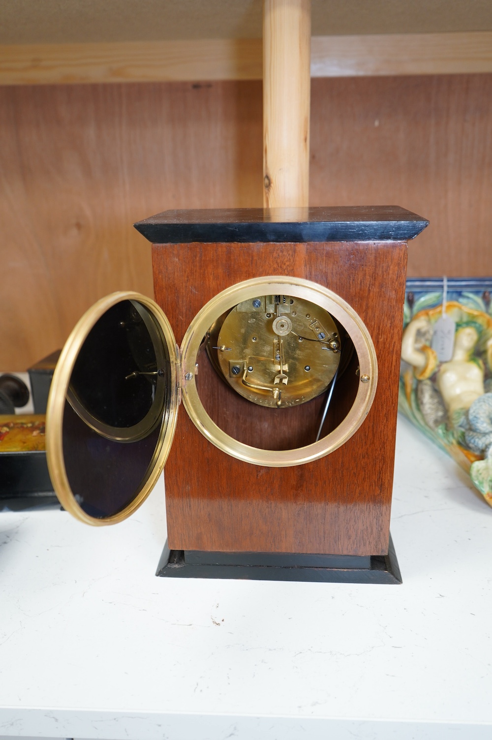 A George V mahogany and ebonised eight day movement mantel clock, 27cm high. Condition - good - No bell.